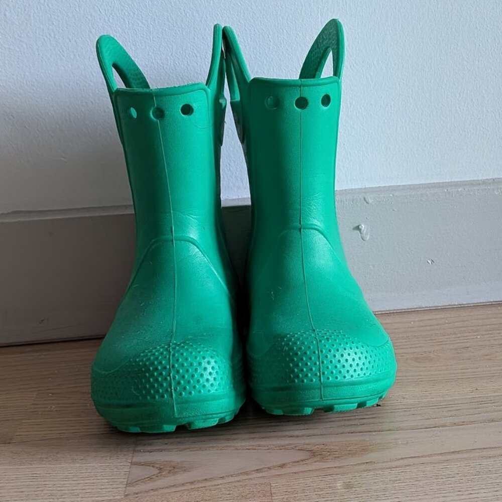 Green Croc rain boots with handles